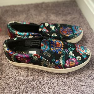Black flower patterned shoes